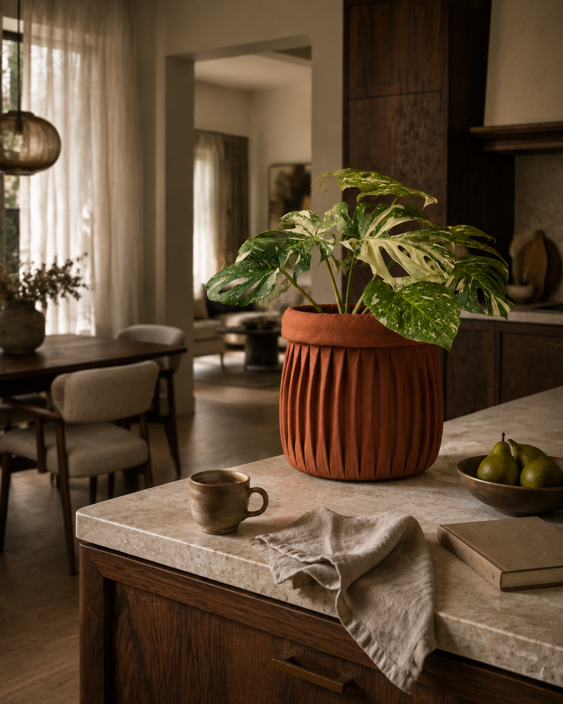 Faded Rose Clay linen planter cover in a warm kitchen and dining interior